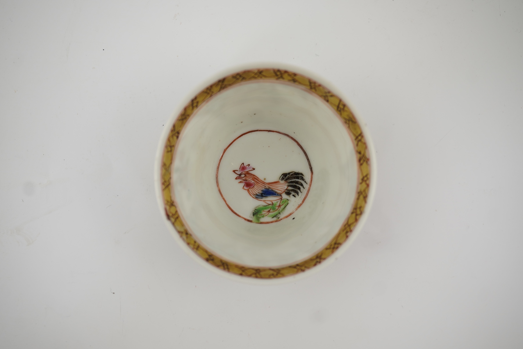 A Chinese semi-eggshell porcelain saucer and a similar tea bowl, Yongzheng period